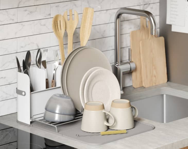 gray fold-out dish rack on counter
