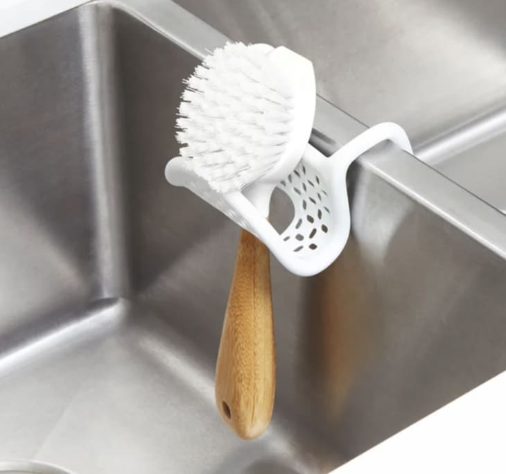 white Sling Coated Wire Sink Caddy holding brush
