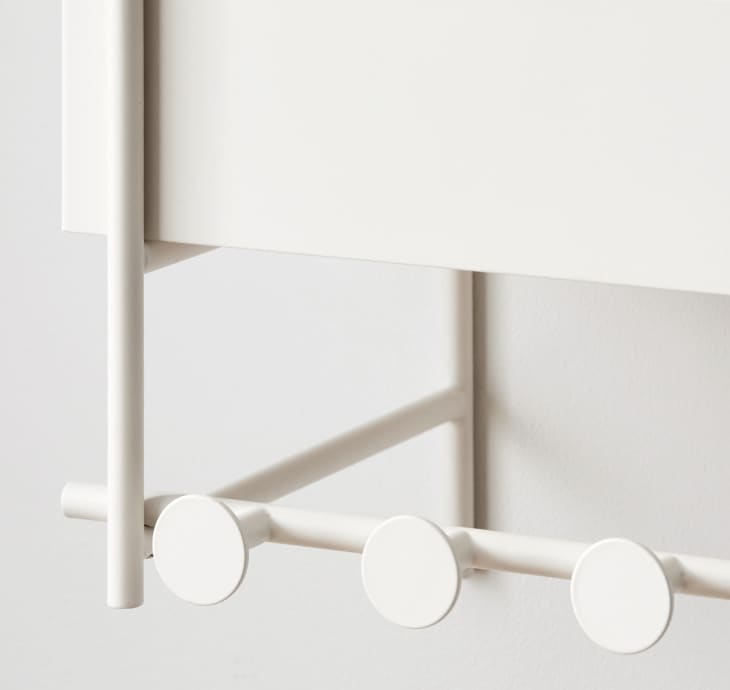 closeup of a white wall shelf's hanging rack