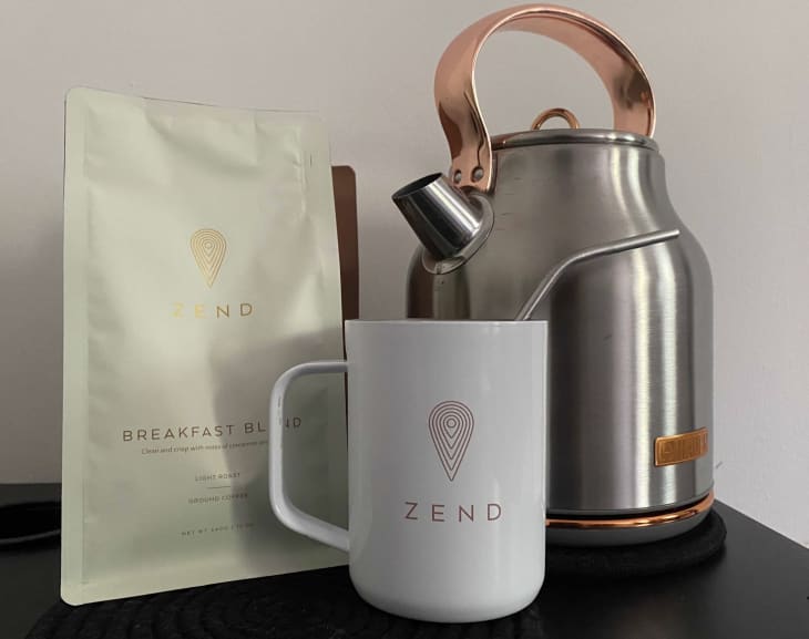 coffee blend bags next to electric kettle and mug