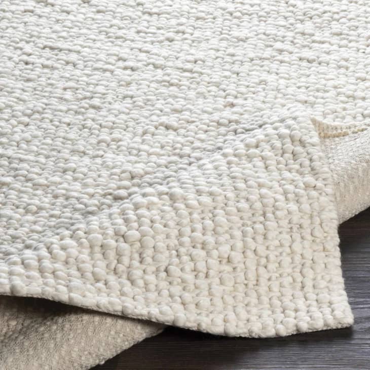 Rockfish Solid Ivory Premium Woven Wool Rug at Boutique Rugs