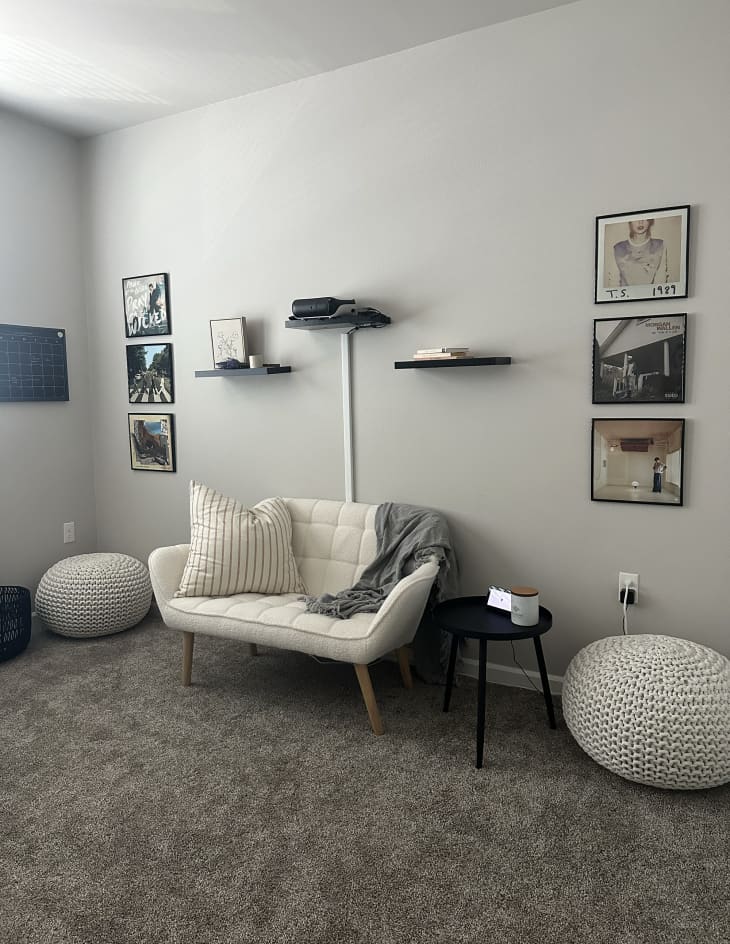 white or gray living room with white loveseat and gray carpet