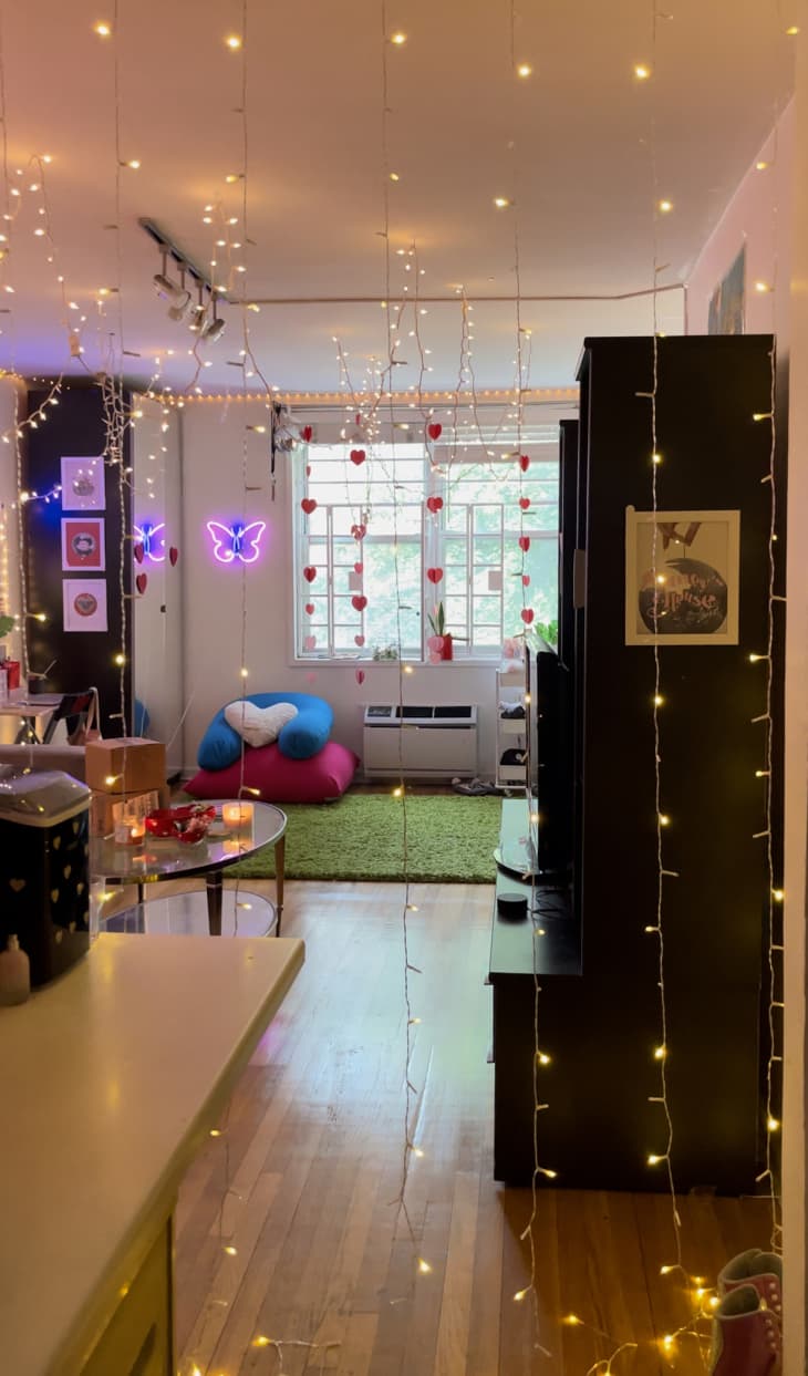 view into dorm room with lots of string lights and windows