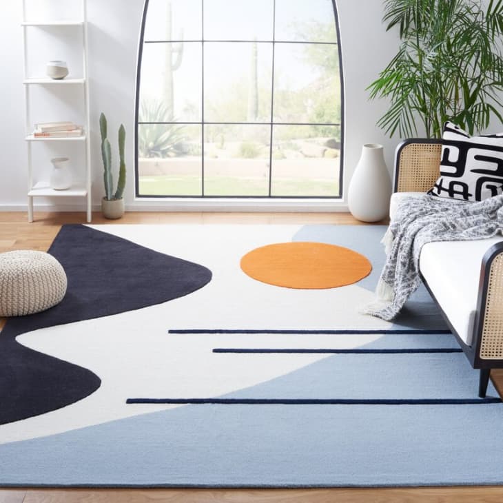 https://cdn.apartmenttherapy.info/image/upload/f_auto,q_auto:eco,w_730/gen-workflow%2Fproduct-database%2FDash_Ivory_Blue_Tufted_Wool_Area_Rug-all-modern