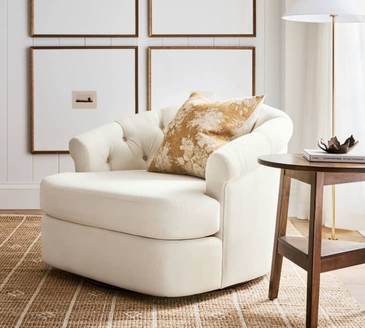 Sutton Tufted Upholstered Swivel Armchair at Pottery Barn