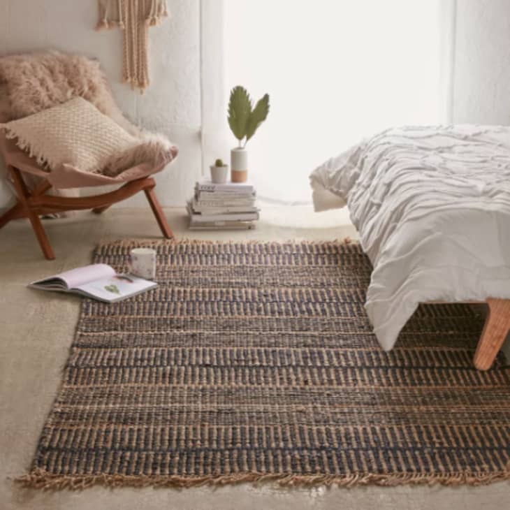 small rug beside bed