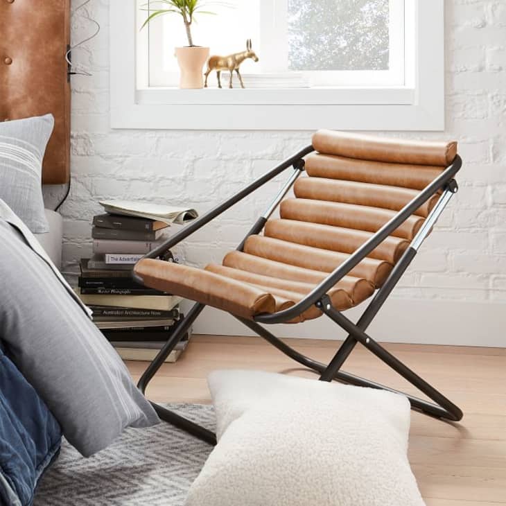 Brown leather sling chair