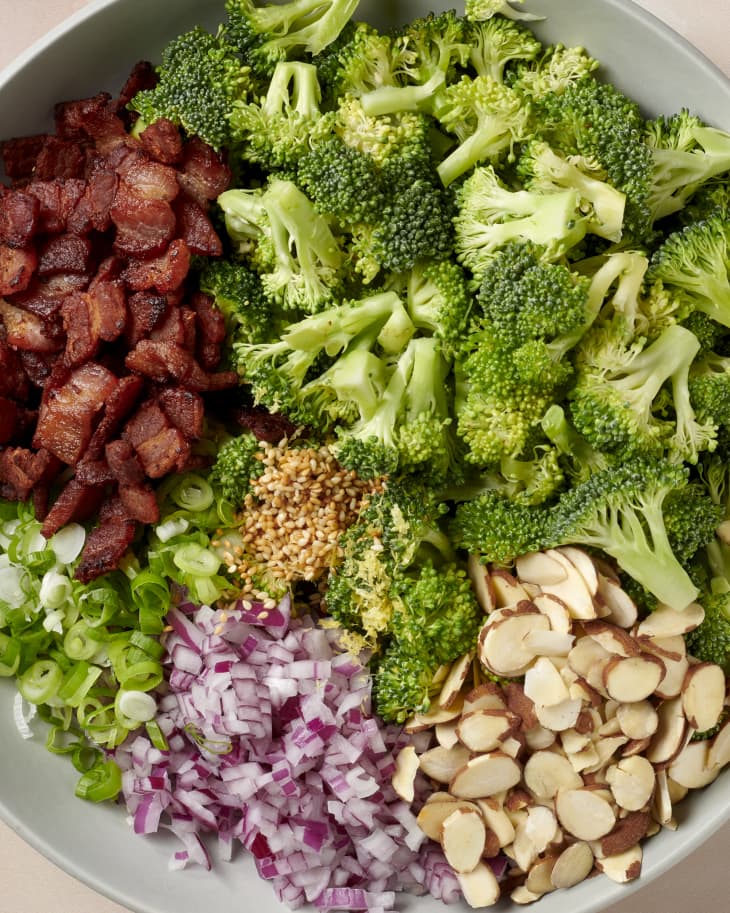 all of the elements of bacon broccoli salad in a bowl, pre-mixing