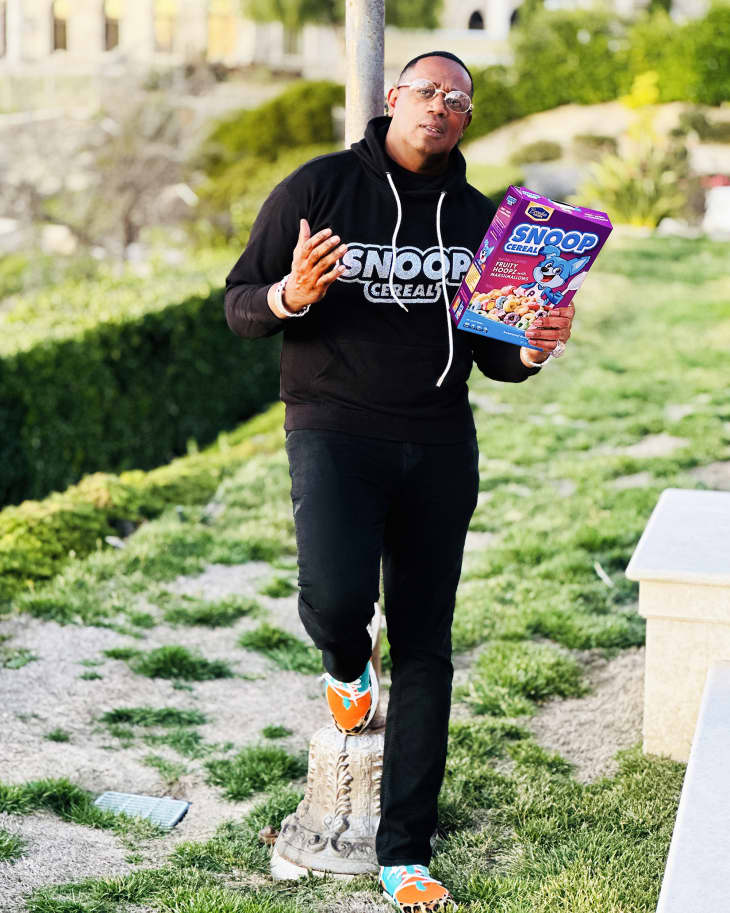 Master P holding box of Snoop Cereal
