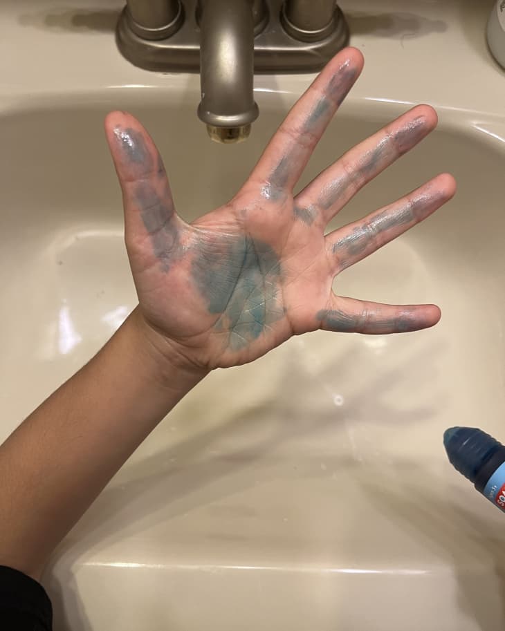 kid washing his hands at the bathroom sink