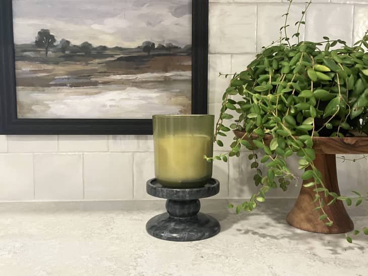 Aldi Huntington Home Candle Pedestal on kitchen counter with green candle