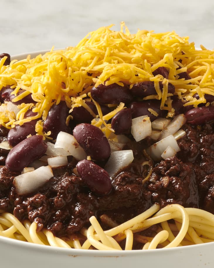 cincinnati chili in a bowl topped with cheese
