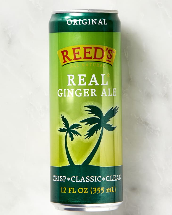 Head on shot of a can of Reeds Real Ginger Ale on a marble surface.