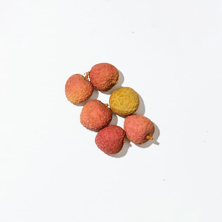 Lychee on a white surface.