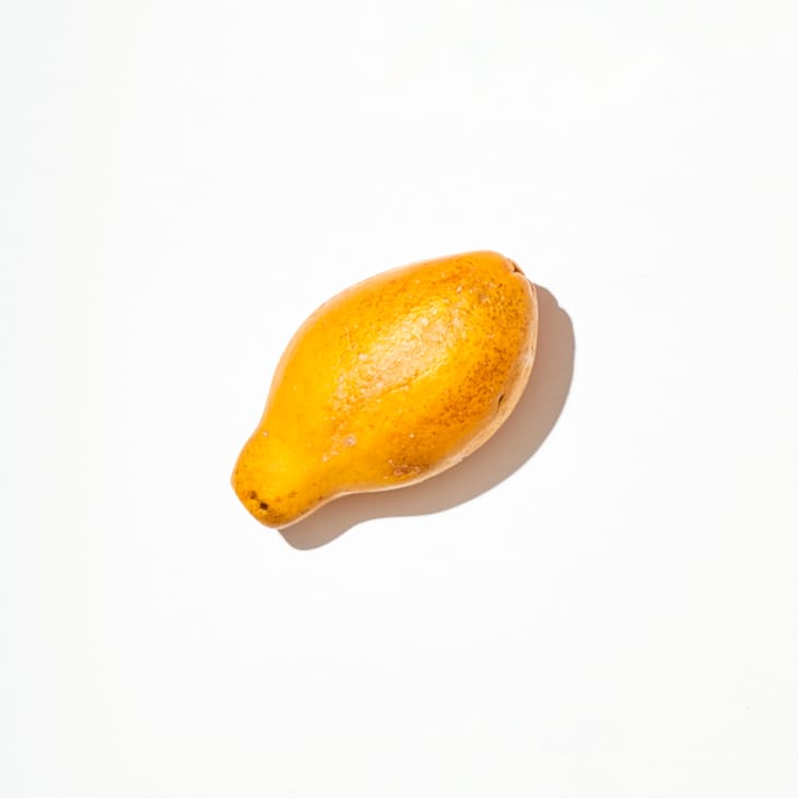 Papaya on a white surface.