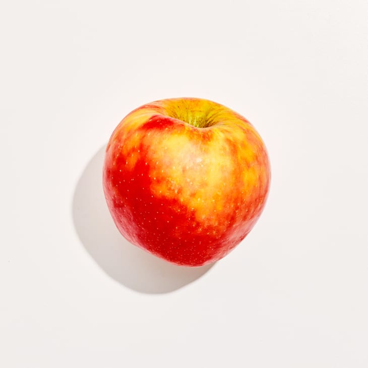 Overhead photo of a Honeycrisp apple on a white background
