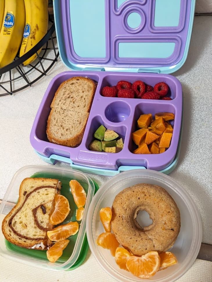 lunch box with compartments for sandwiches, bagel, and fruit