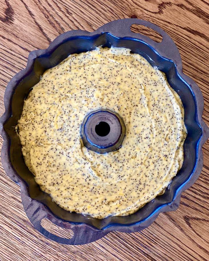 bundt cake pan filled with lemon poppyseed dough