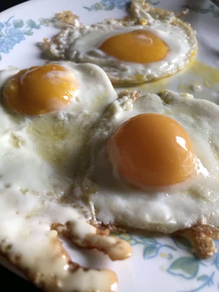 three fried eggs on plate