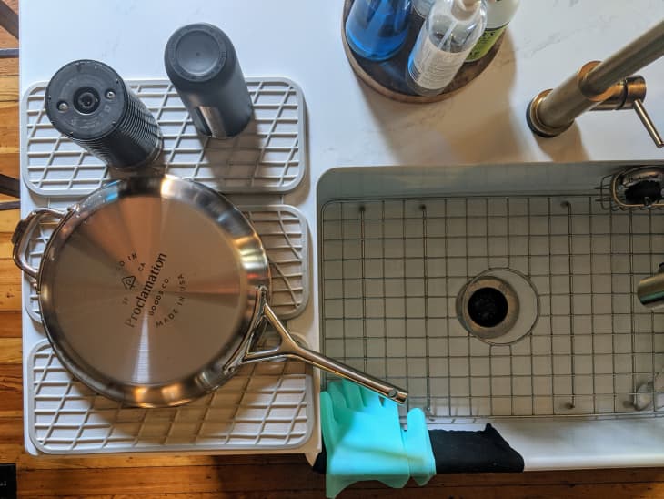 dish drying rack next to sink with pan