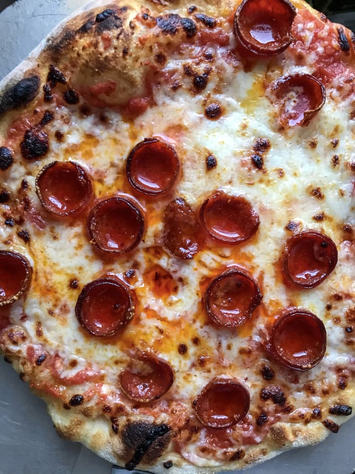 pepperoni pizza on baking sheet
