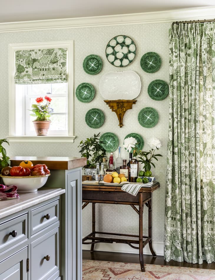 green decorative plates displayed in circle on wall