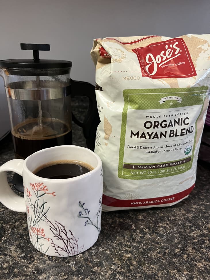 bag of Jose's Mayan blend coffee next to a mug of coffee and French press