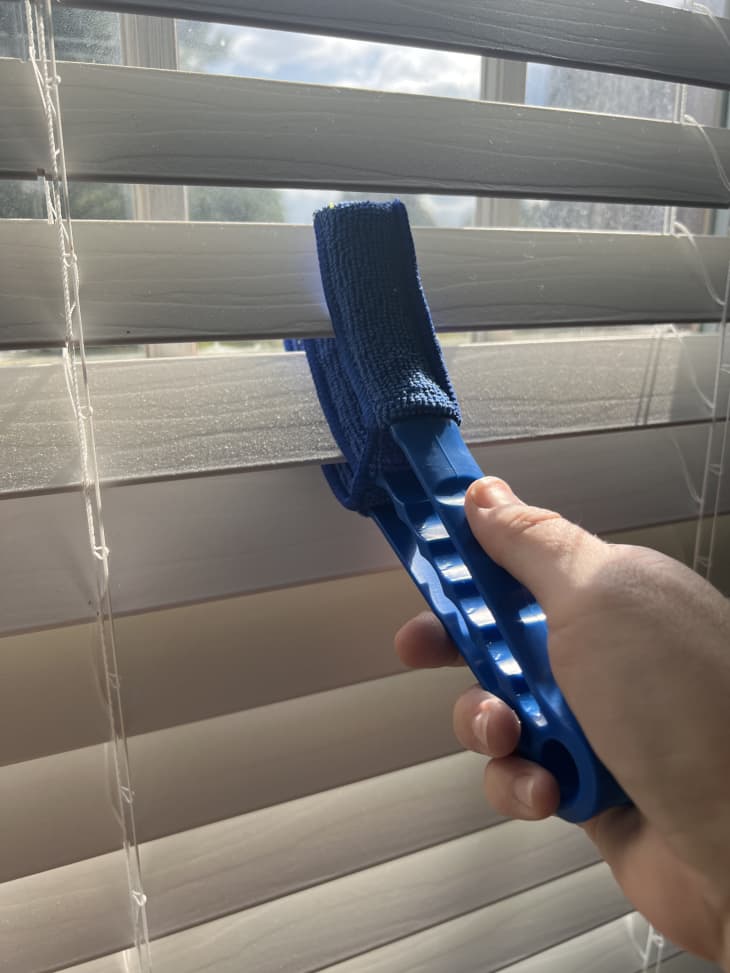 using the dusting tool on window blinds