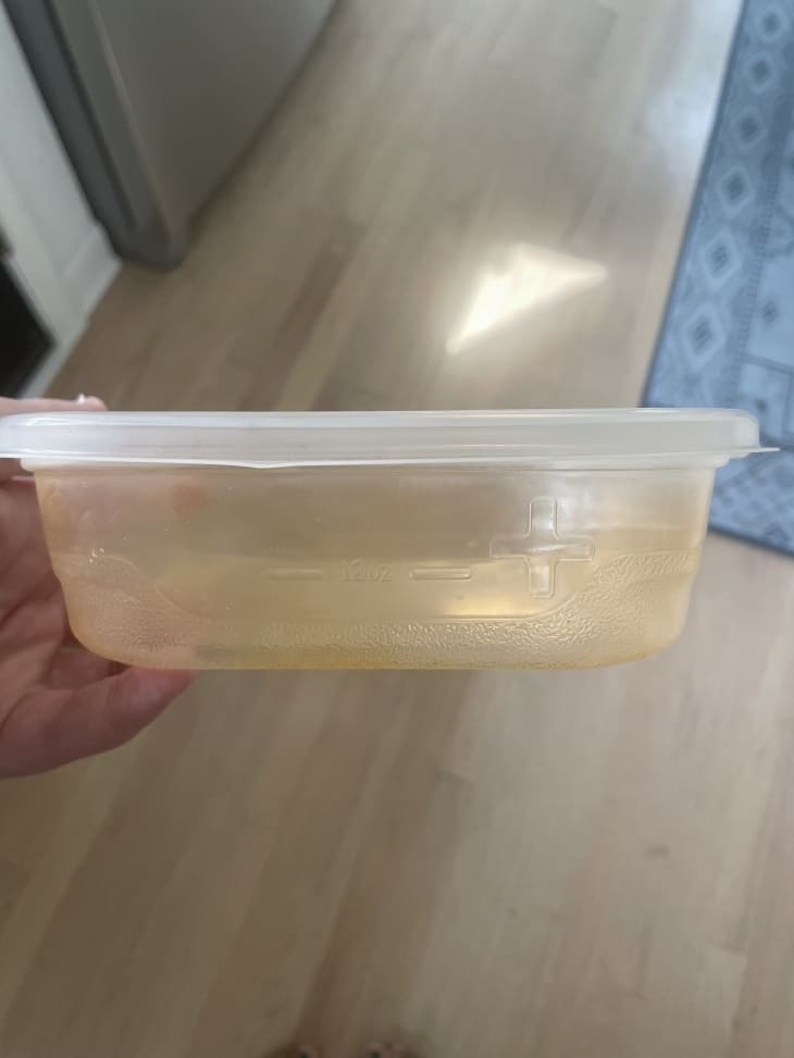 side view of soapy water in Tupperware