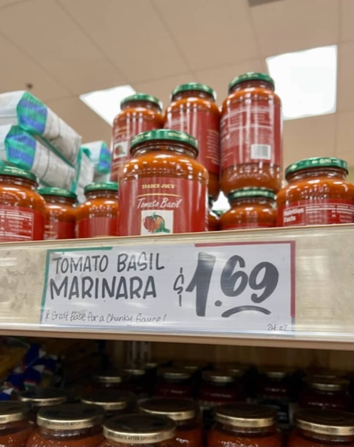 Trader Joe's tomato basil marinara on shelf, $1.69 price tag