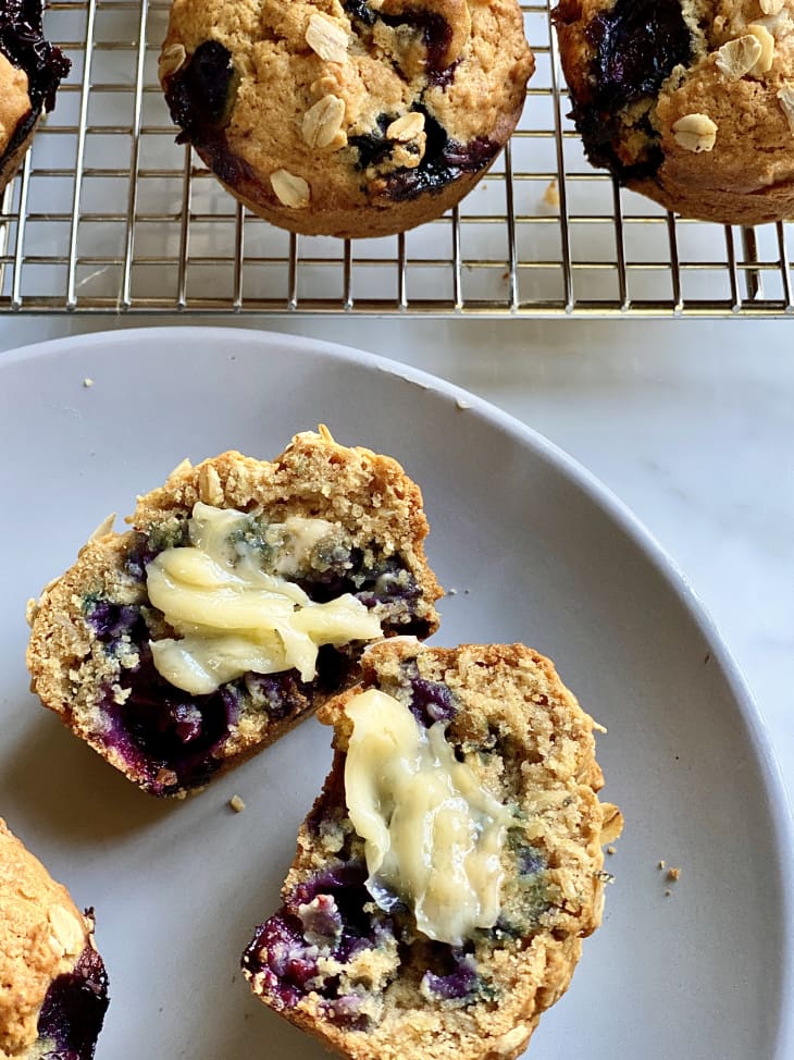 Photograph of blueberry oatmeal muffins slathered in muffins.