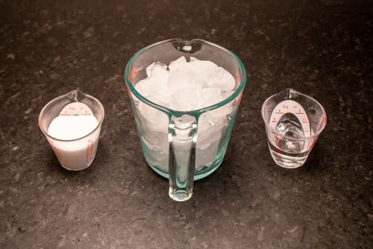 salt, ice, and water in measuring cups