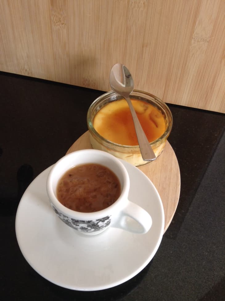 cup of cappuccino and creme brulee with spoon