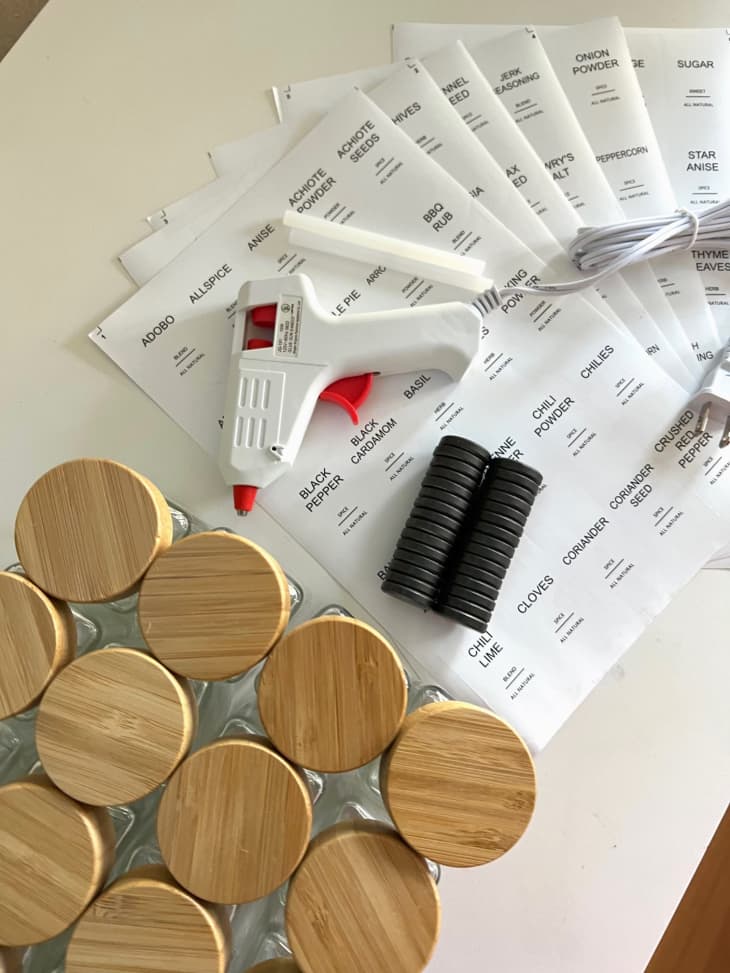 materials: empty spice jars, magnets, hot glue gun, labels