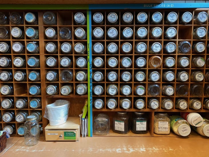jars of spiced organized in wall compartments