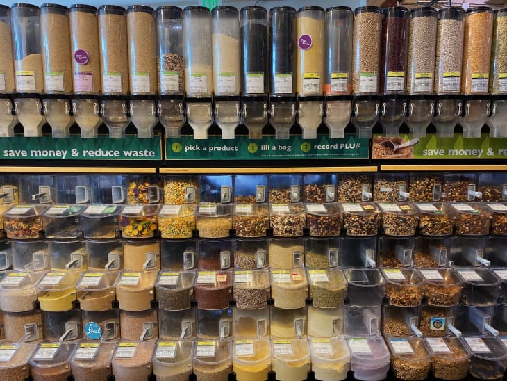bulk section of Whole Foods with foods in various plastic bins