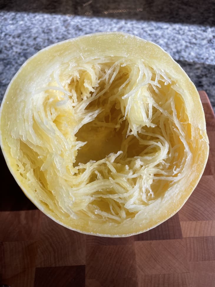 spaghetti squash half after cooking in microwave