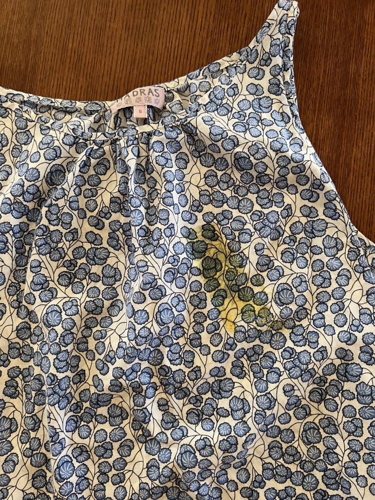 patterned shirt with mustard stain