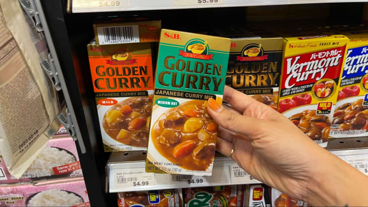 hand holding S&amp;B golden curry mix