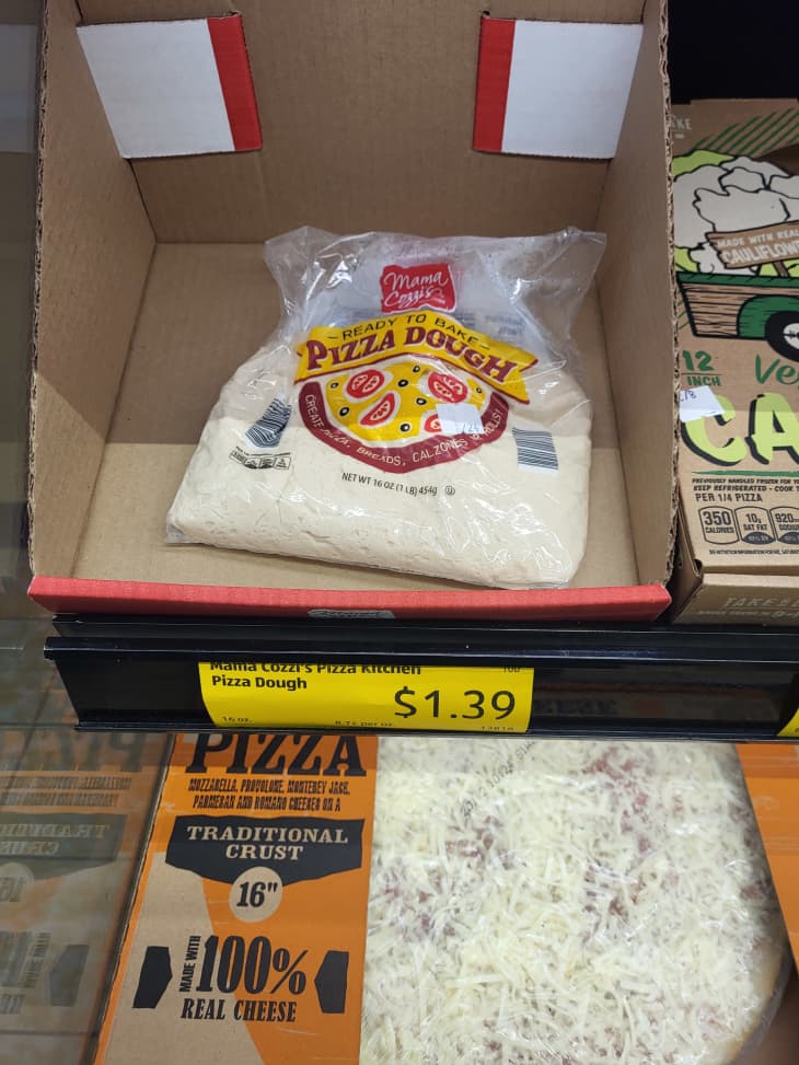 bag of Mama Cozzi's pizza dough on display at store, $1.39