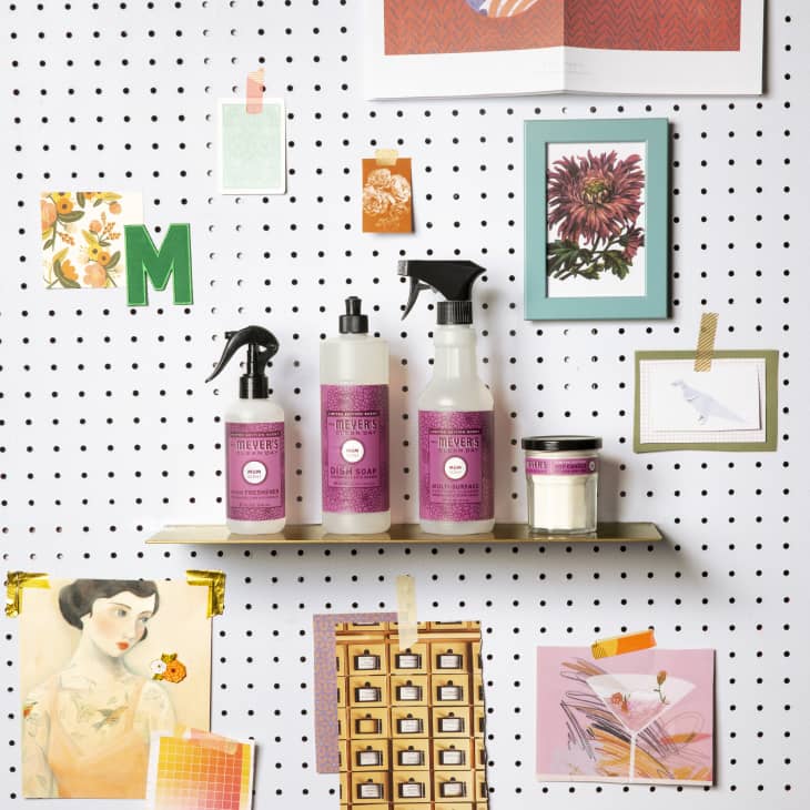 assorted Mrs. Meyer's products on shelf attached to a pegboard