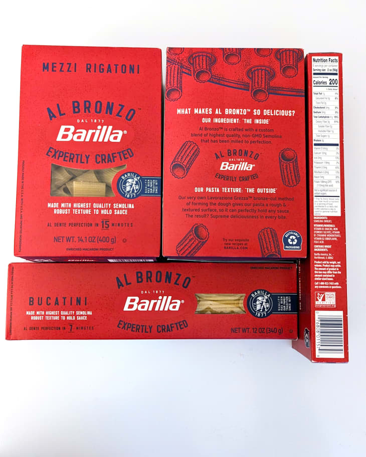Barilla dried pasta packets on light background.