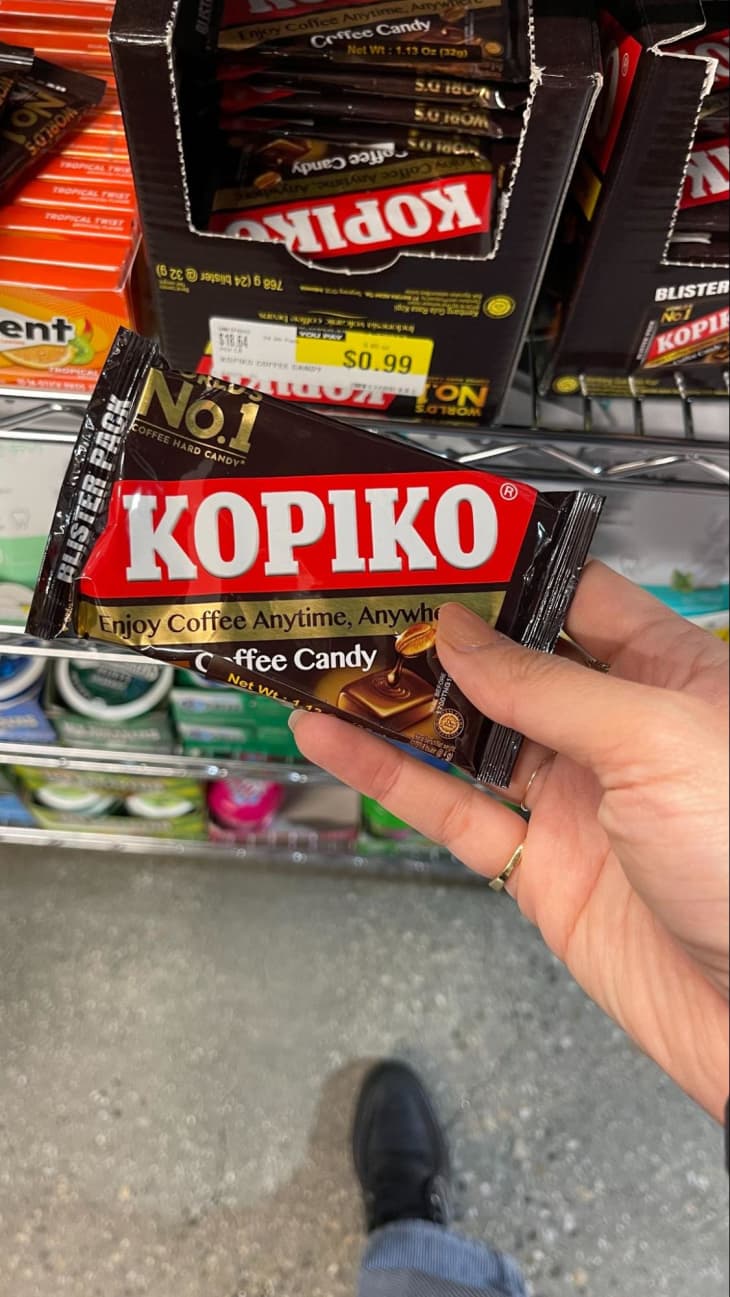 Somone holding Kopiko coffee candy at H-Mart.
