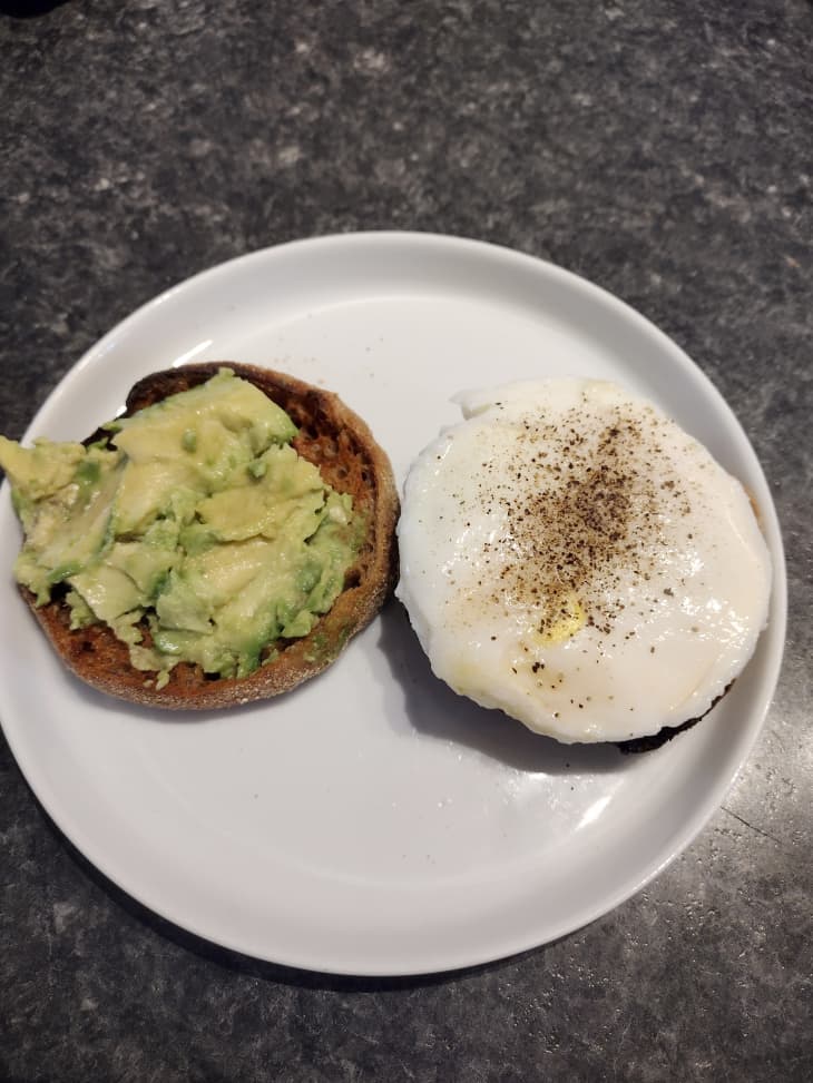 English muffin, toasted. Half with egg, half with avocado
