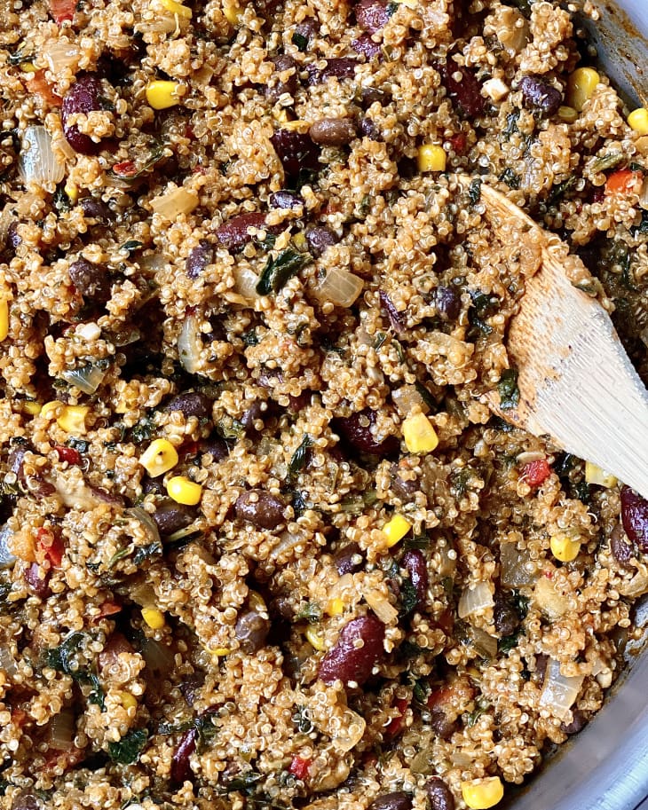 Caribbean-Style Beans and Greens Quinoa Skillet, closeup with wooden spoon