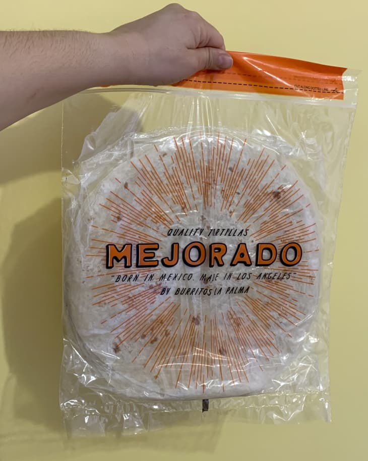 Someone holding bag of Mejorado flour tortillas
