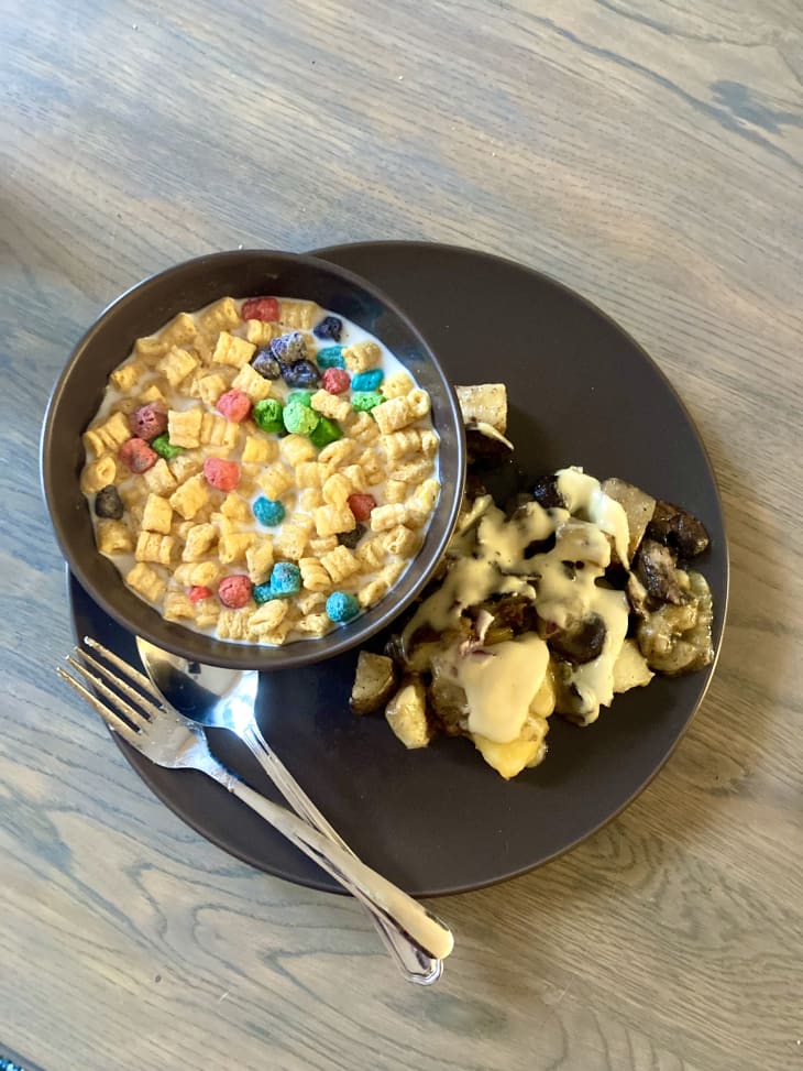 bowl of mixed cereal next to potato skillet on plate