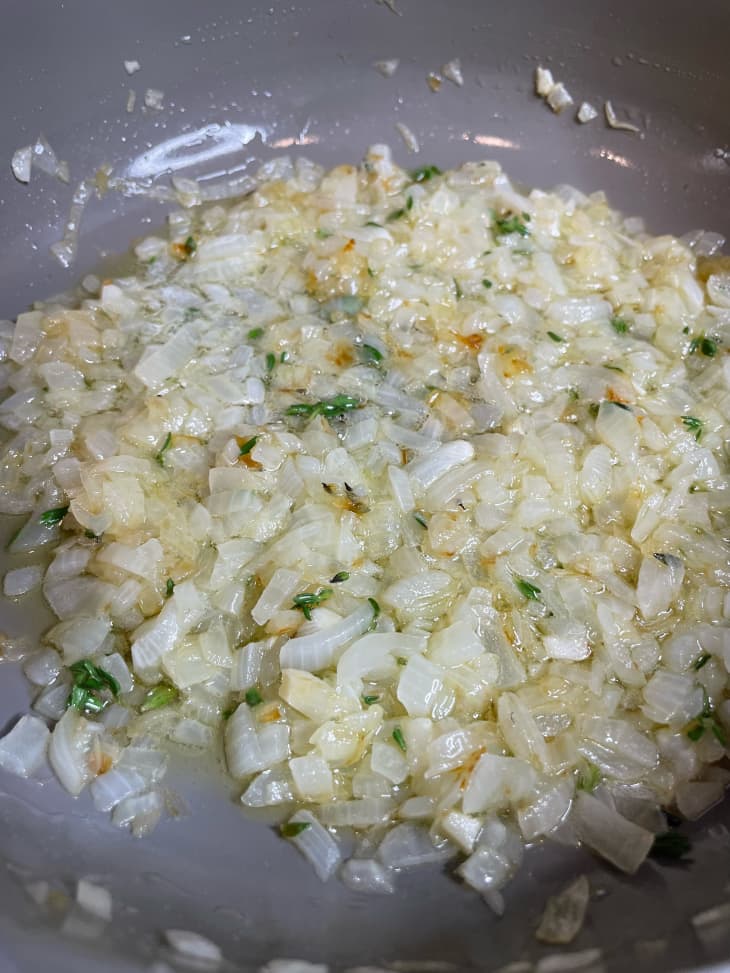 Onions cooking in skillet.