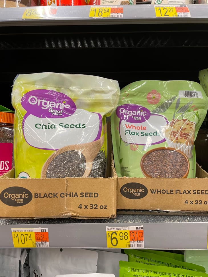 Packages of chia seeds and whole flax seeds on store shelves.