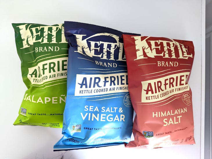 Various flavors of air fried Kettle brand potato chips.